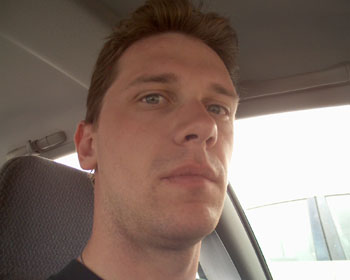 No, I'm not driving.  The car is at a stoplight